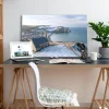 Tableau photo des Falaises d'Etretat sous la neige, au format 60 x 90 cm posé sur un bureau